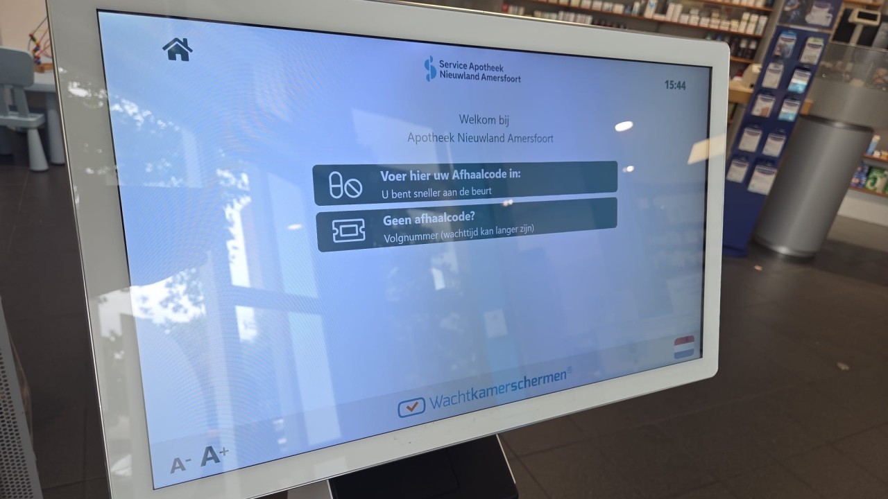 Close up queue management kiosk at Apotheek Nieuwland